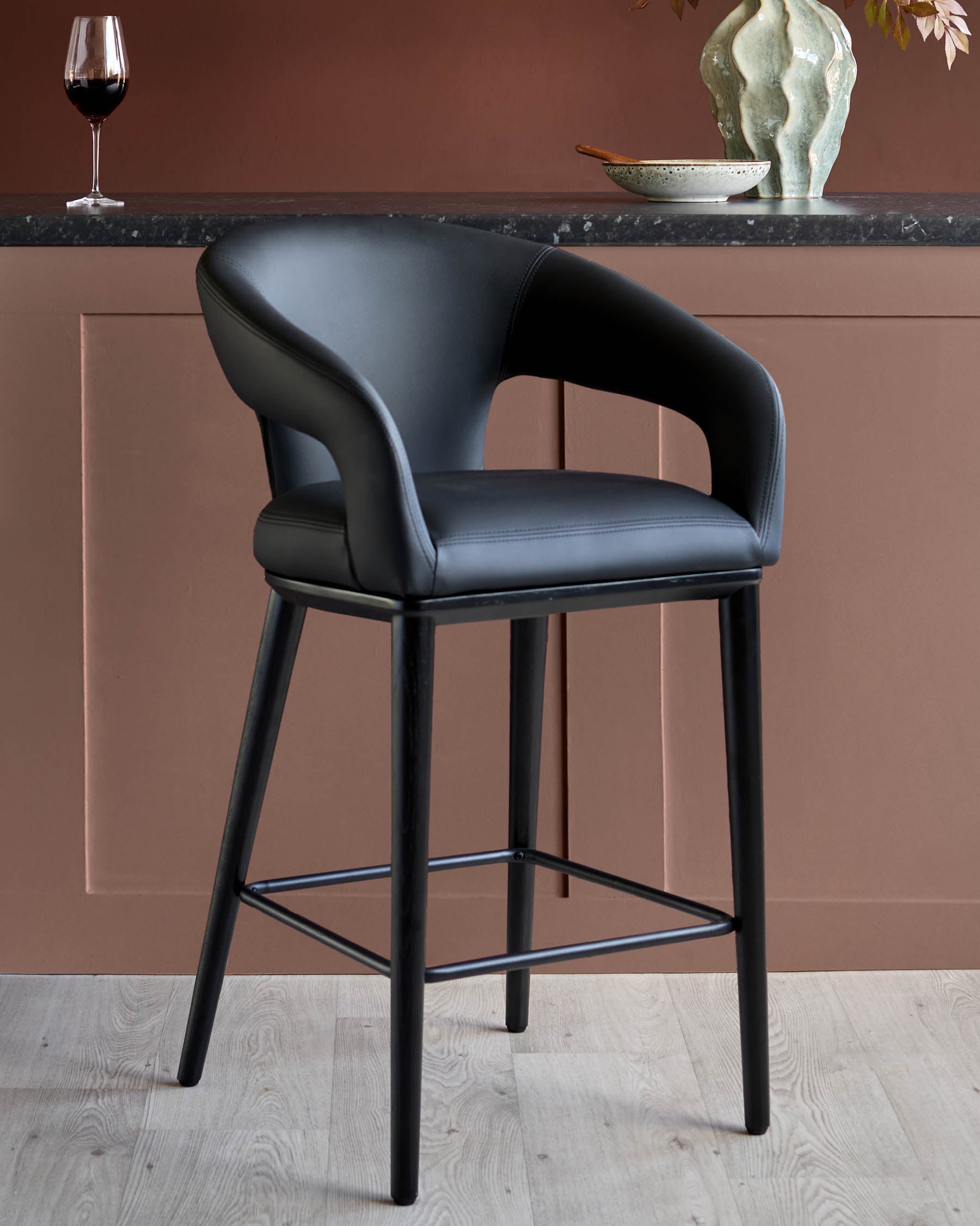 Heath black faux leather bar stool